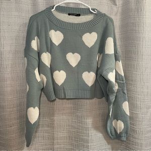 Teal blue crew neck sweater with cream white hearts